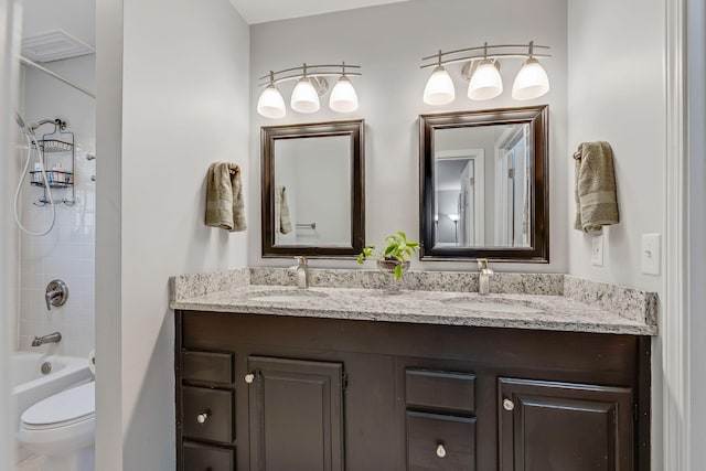 full bathroom with vanity, toilet, and shower / bath combination