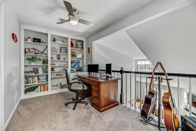 carpeted home office with ceiling fan