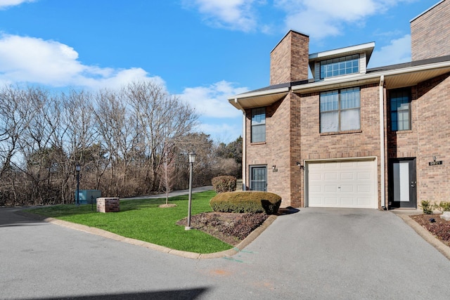 view of home's exterior with a yard and a garage