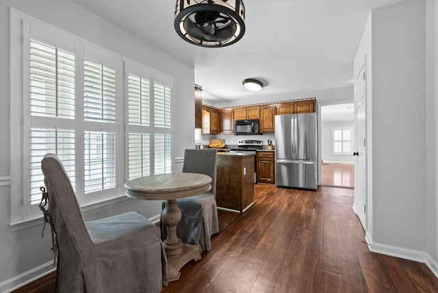 dining space featuring dark hardwood / wood-style flooring