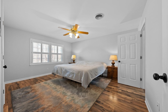 bedroom with dark wood-type flooring and ceiling fan