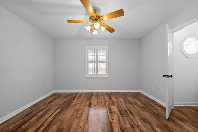 unfurnished room with ceiling fan, dark wood-type flooring, and a healthy amount of sunlight