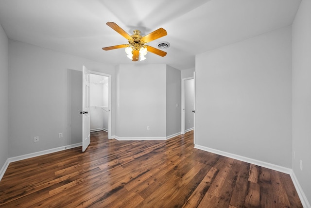 interior space featuring dark wood-type flooring and ceiling fan