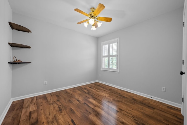 unfurnished room with dark wood-type flooring and ceiling fan