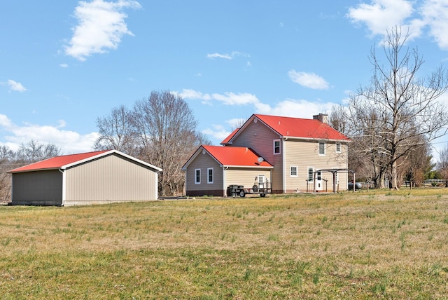 back of house with a yard