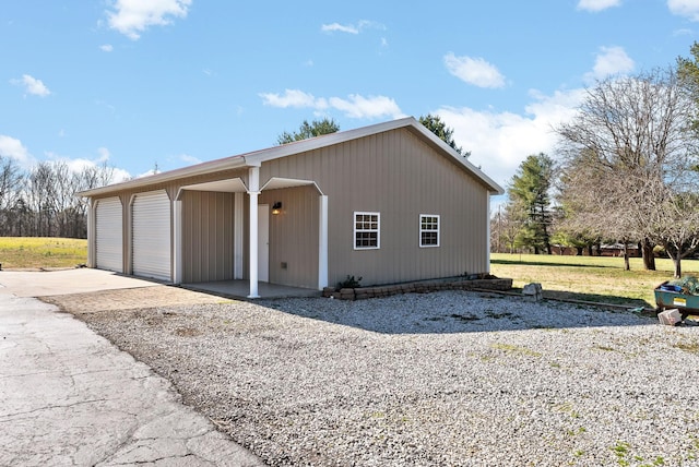 view of front of property with an outbuilding and a garage