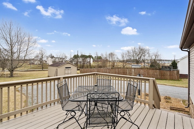 wooden terrace featuring a storage shed