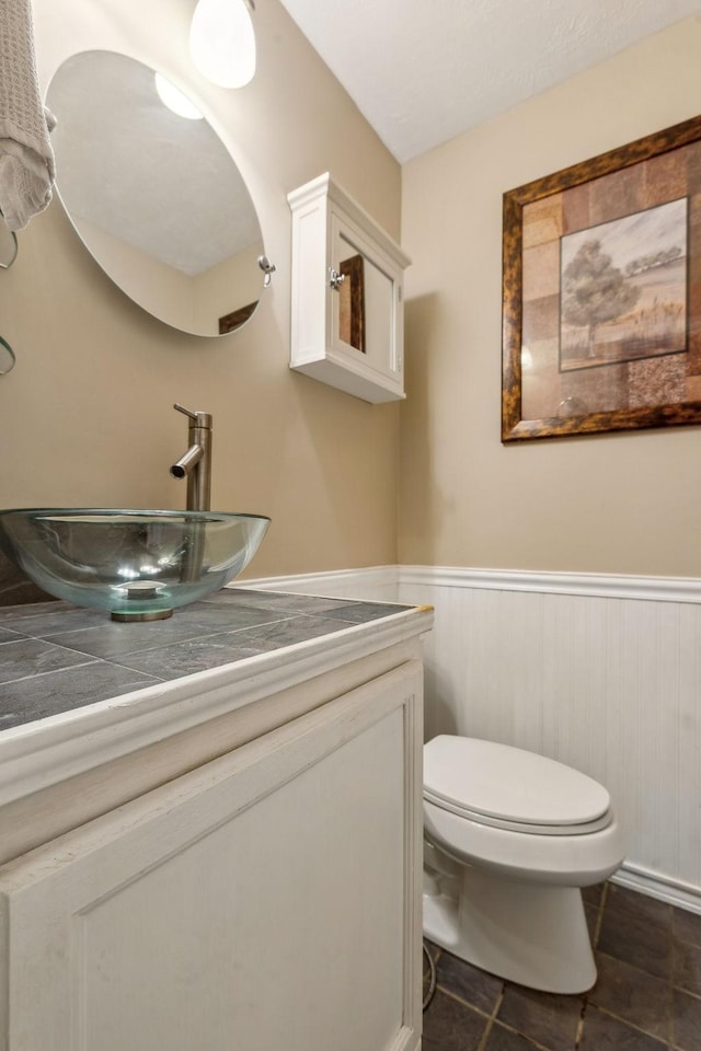 bathroom with vanity and toilet