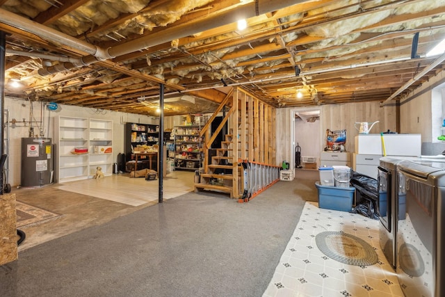 basement with washing machine and clothes dryer and water heater