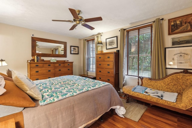 bedroom featuring hardwood / wood-style floors and ceiling fan