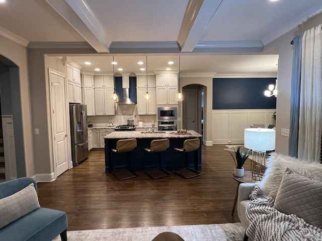 living room with beamed ceiling, crown molding, and dark wood-type flooring