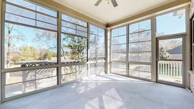 unfurnished sunroom with a wealth of natural light and ceiling fan