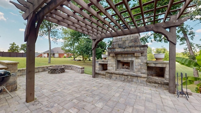 view of patio with a fire pit, a pergola, and an outdoor stone fireplace