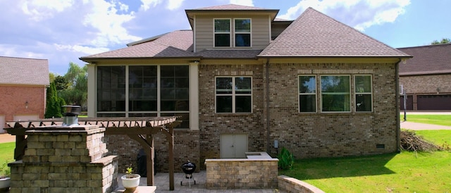 back of house featuring a pergola and a yard