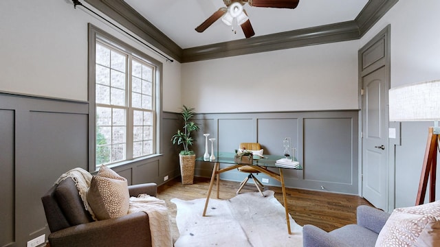 home office featuring ornamental molding, ceiling fan, and light hardwood / wood-style flooring