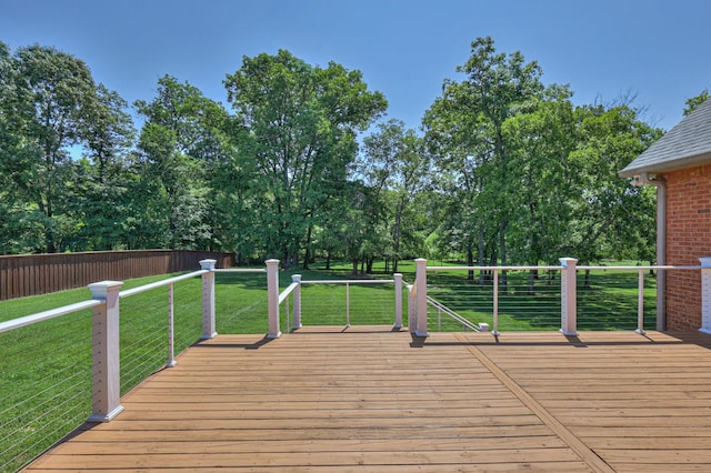 wooden terrace with a lawn