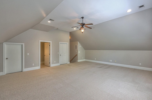 bonus room featuring ceiling fan, light colored carpet, and vaulted ceiling