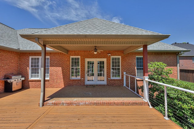 wooden deck featuring a grill, ceiling fan, and french doors