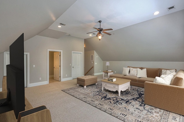 living room featuring light carpet, lofted ceiling, and ceiling fan