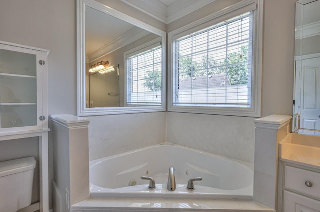 bathroom featuring vanity, a healthy amount of sunlight, tiled bath, and ornamental molding