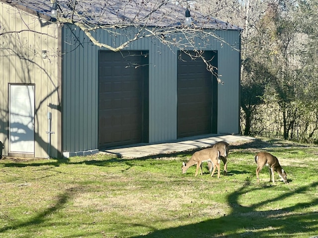 view of outbuilding with a lawn