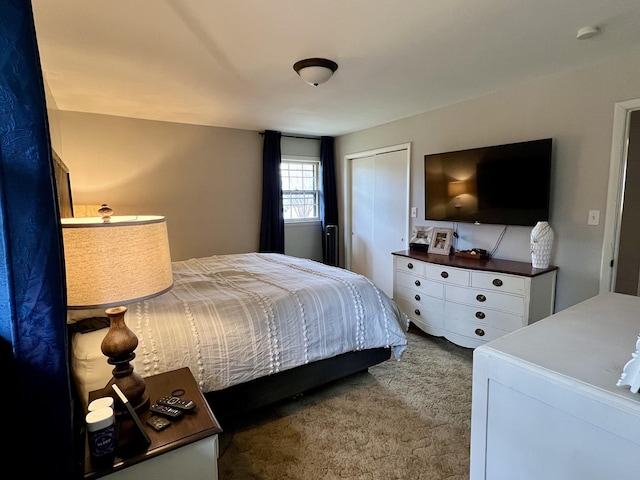 carpeted bedroom with a closet