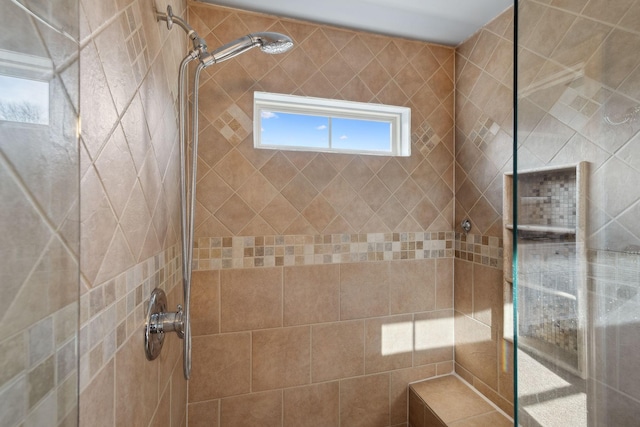 bathroom featuring a tile shower