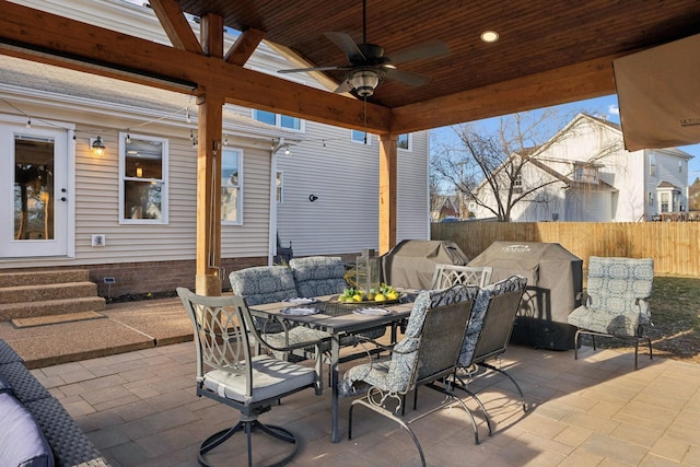 view of patio with area for grilling and ceiling fan