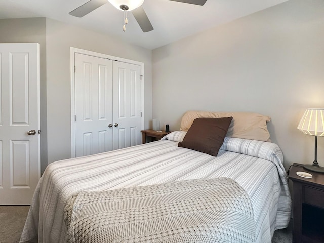 bedroom with ceiling fan and a closet