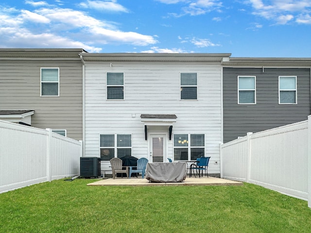 back of house with a patio, a yard, and central AC unit