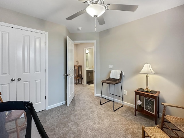 carpeted bedroom featuring ceiling fan and a closet