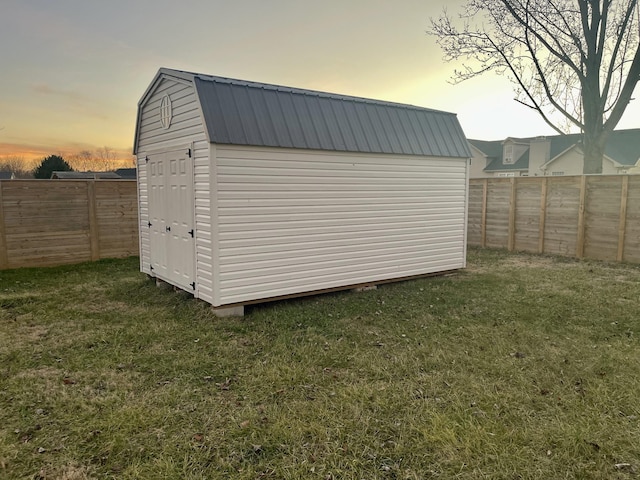 outdoor structure at dusk with a yard