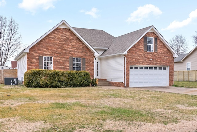 front of property with a garage, central AC, and a front lawn