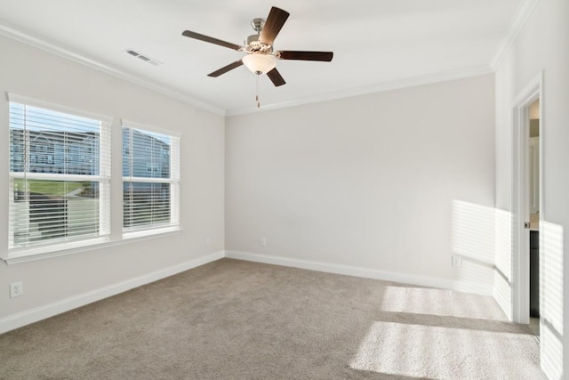 empty room with light carpet, ornamental molding, and ceiling fan