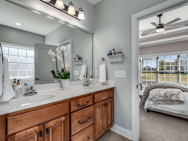 bathroom featuring tile patterned flooring, vanity, and ceiling fan