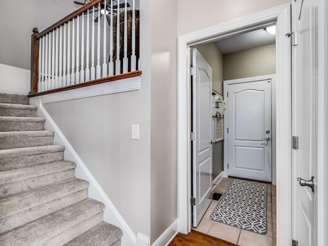 stairs with tile patterned floors