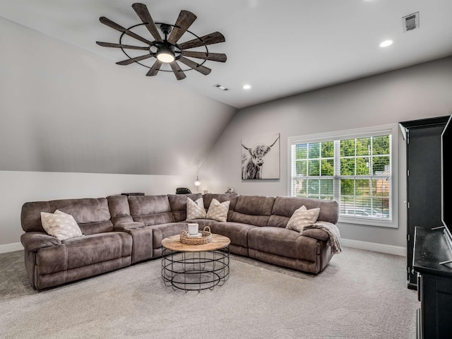 carpeted living room featuring vaulted ceiling and ceiling fan