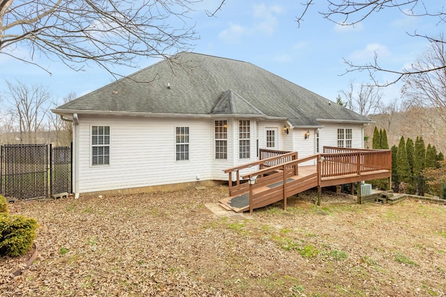 back of house with a wooden deck