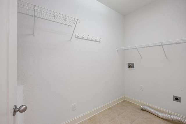 clothes washing area featuring hookup for a washing machine and hookup for an electric dryer