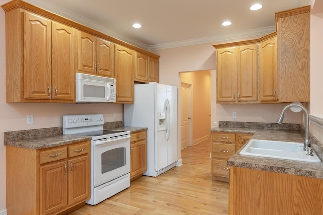 kitchen featuring crown molding, sink, white appliances, and light wood-type flooring