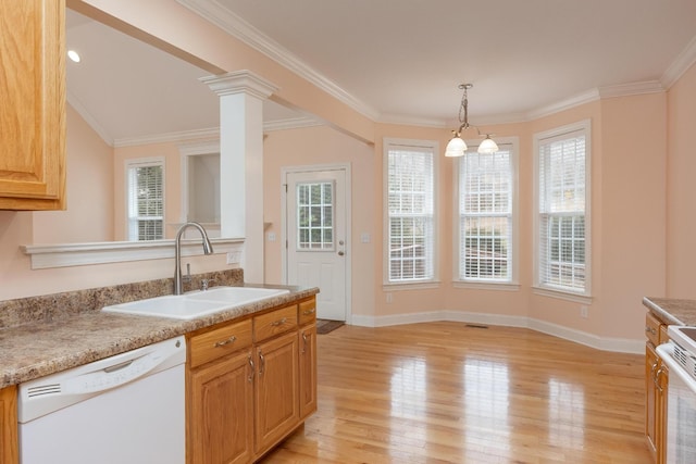 kitchen with ornate columns, sink, ornamental molding, white appliances, and light hardwood / wood-style flooring