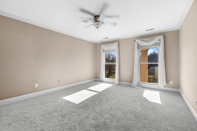 unfurnished room featuring a ceiling fan, baseboards, visible vents, carpet floors, and ornamental molding