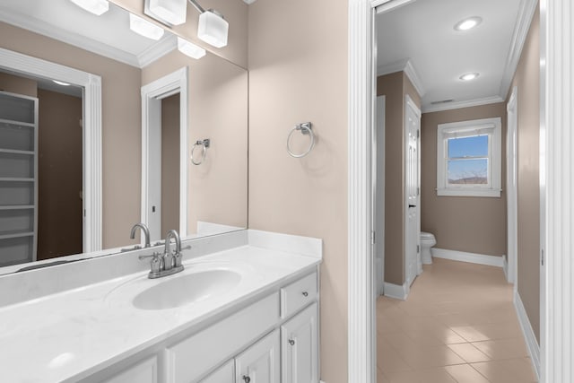 bathroom featuring crown molding, baseboards, toilet, recessed lighting, and vanity