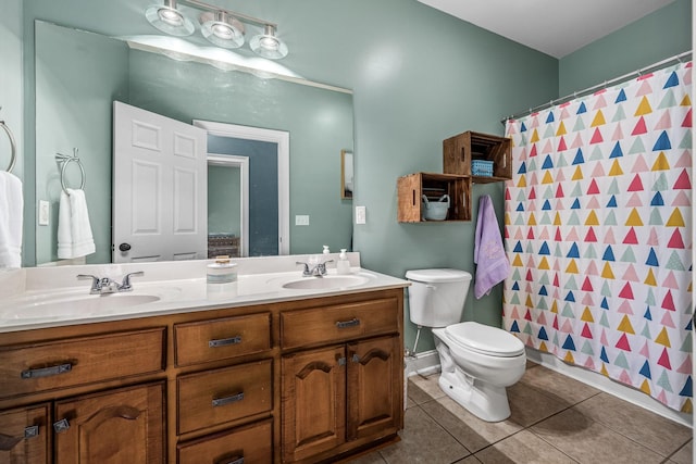 bathroom with a shower with curtain, tile patterned floors, toilet, and vanity