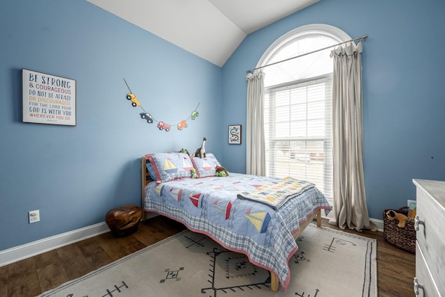 bedroom featuring hardwood / wood-style flooring and lofted ceiling