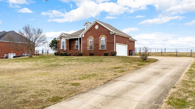 view of side of home featuring a garage and a lawn