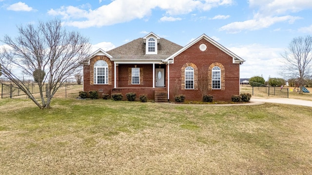 view of front of house with a porch and a front yard