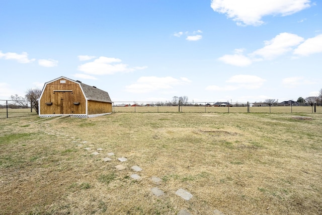 view of yard with a rural view and a shed