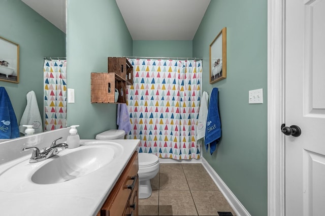 bathroom featuring tile patterned flooring, vanity, a shower with curtain, and toilet