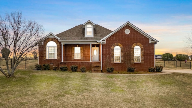 view of front of home with a yard